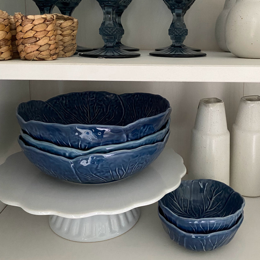 blue bowls with white cake stand