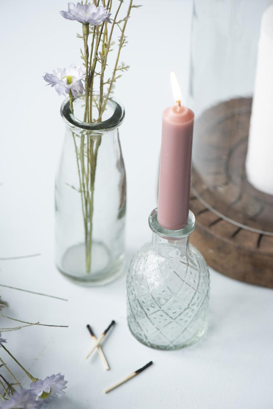 small glass bottle for candle or flowers