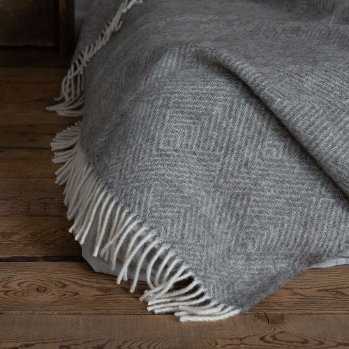 grey and cream blanket or throw